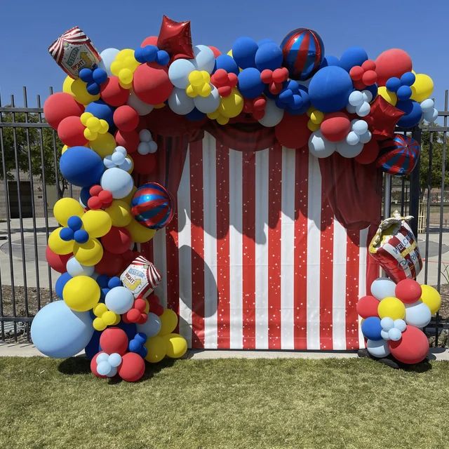 a circus themed birthday party with balloons and streamers