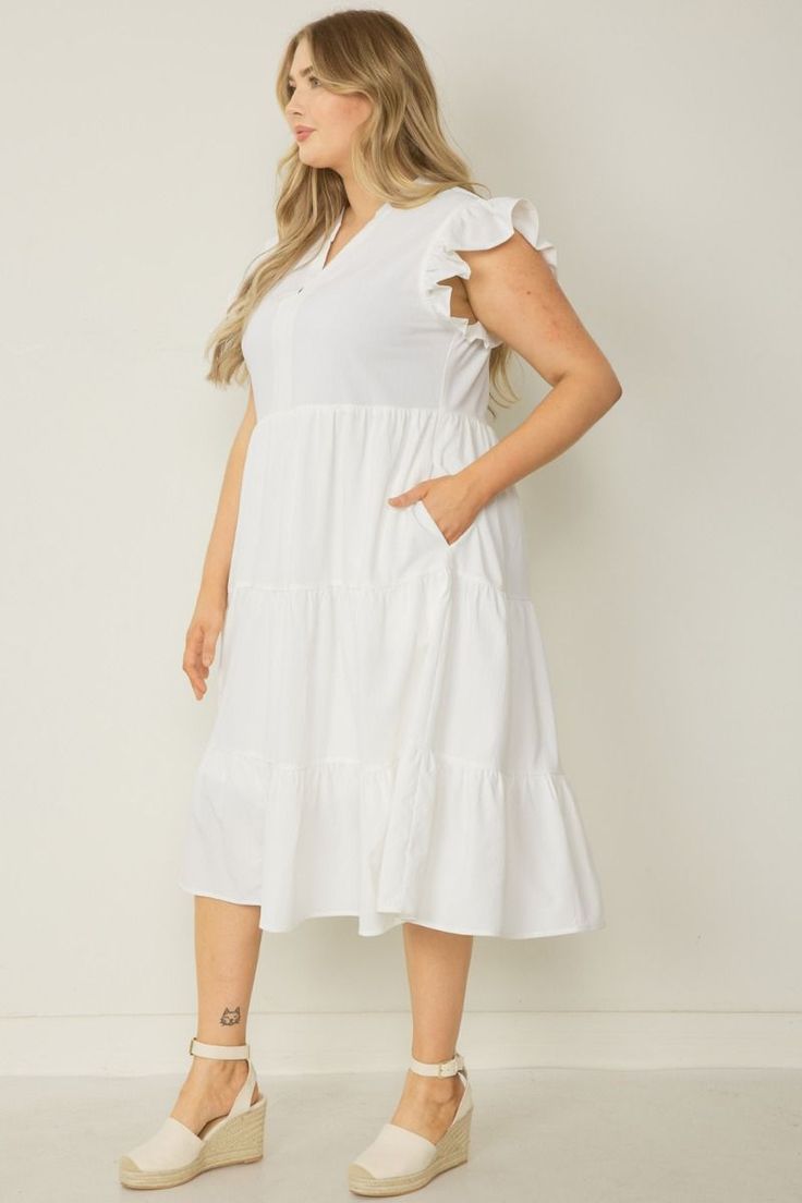 This Ruffled Pocket Tiered Midi Dress is perfect for any occasion! It's lightweight, has fun sleeves that are ruffled to perfection, and can easily be switched from casual to dressy. Forget a closet full of options-- this dress has you covered! This dress features a v-neck, placket, ruffled cap sleeves, pockets, is lined and has a tiered flowy midi silhouette. It's the perfect additional to your wardrobe. Small Bust 38" Length 44" : Medium Bust 40" Length 44" Large Bust 42" Length 44" : XL Bust Spring Tiered Flutter Sleeve Dress With Ruffle Hem, Spring Tiered Dress With Ruffle Hem And Flutter Sleeves, Spring Tiered Dress With Flutter Sleeves For Brunch, Casual Tiered Dress With Flutter Sleeves For Brunch, Casual Ruffle Dress With Ruffle Hem And Sleeves, Casual Ruffle Sleeve Dress For Day Out, Chic Tiered Ruffle Sleeve Dress For Spring, White Flutter Sleeve Midi Dress For Spring, Casual Tiered Dress With Flutter Sleeves And Ruffles