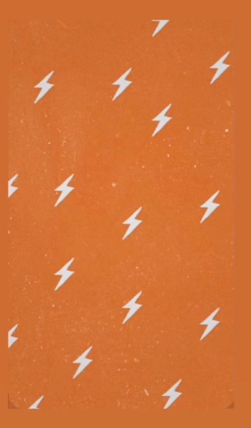 an orange background with white lightnings on it