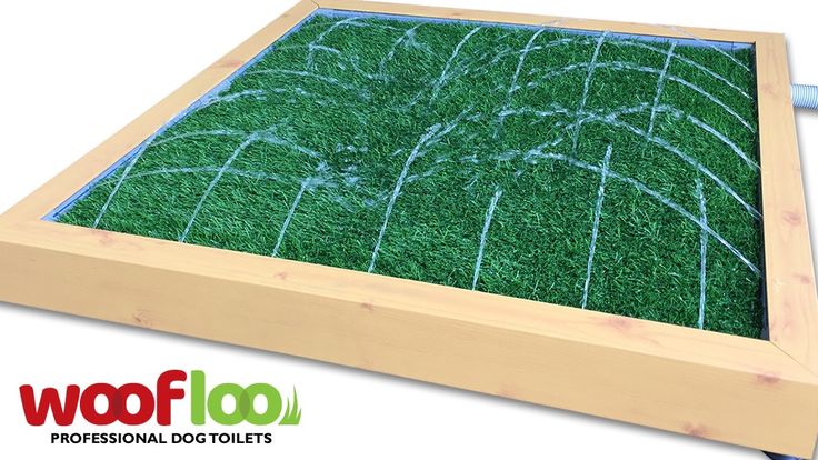 a wooden frame with artificial grass in it