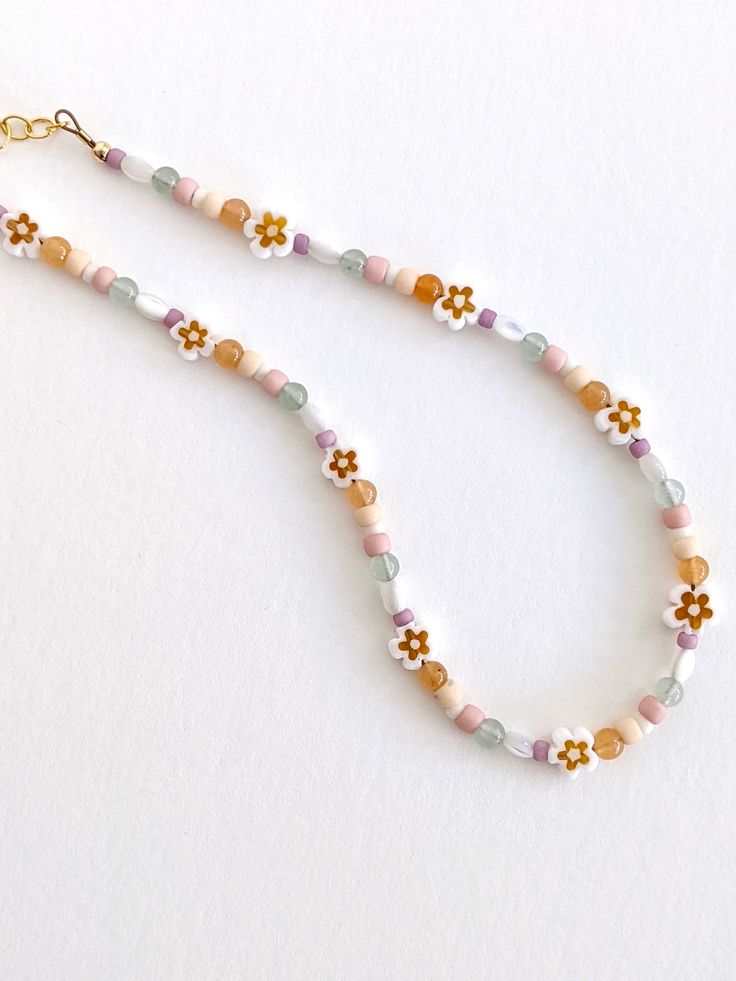 The perfect spring necklace 🌼 Choker style Gold-filled chain, clasp, & extender Intended for ages 2 years & up. Cute Flower Beaded Necklaces With Colorful Beads, Cute Flower-shaped Colorful Beaded Necklaces, Casual Beaded Necklaces For Spring Gift, Casual Beaded Necklace For Spring Season Gift, Colorful Beaded Necklaces For Spring, Handmade Beaded Bracelets For Spring, Spring Beaded Necklaces As Gifts, Playful Handmade Beaded Bracelets For Spring, Colorful Round Beaded Necklaces For Spring