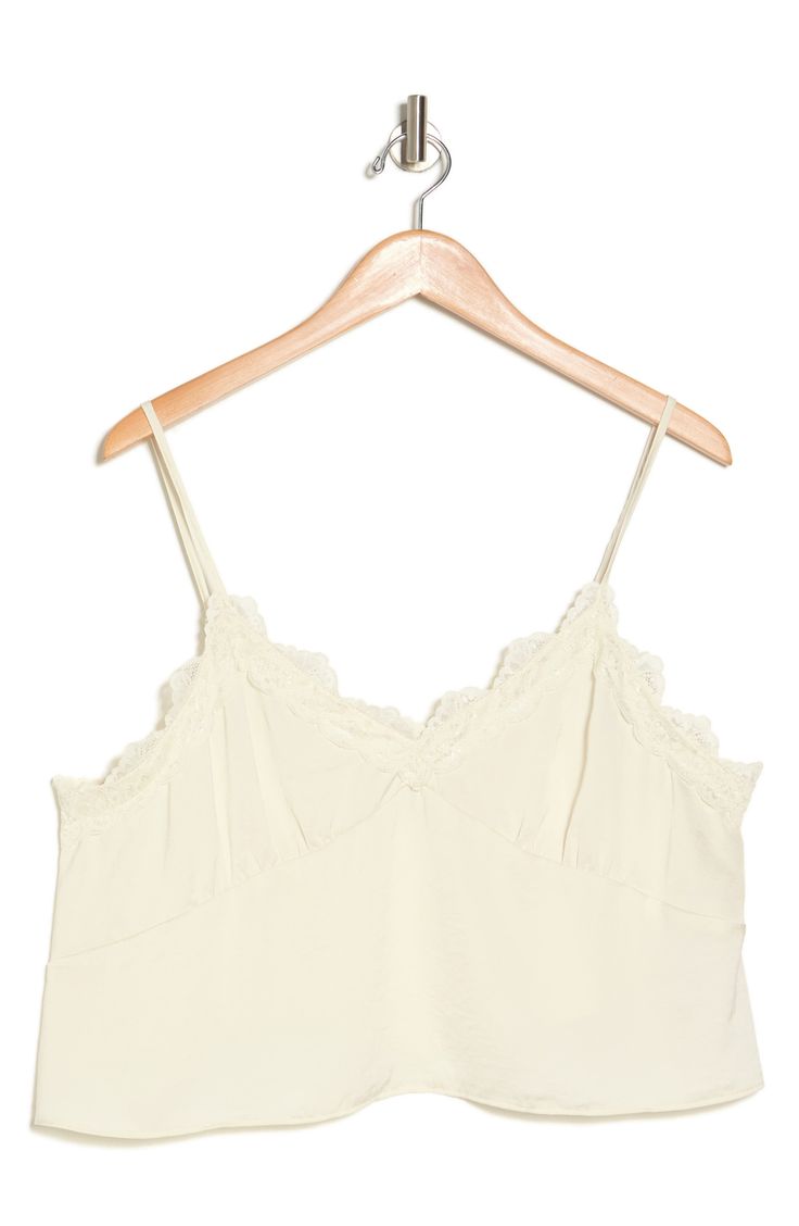 Showcase your sultry style in this flattering cropped camisole trimmed with lovely lace. 20" length (size 1X) V-neck Spaghetti straps 100% polyester Hand wash, line dry Imported V-neck Lace Crop Top With Lace Trim, V-neck Tank Top With Lace Trim For Daywear, Cropped Lace Tank Top With Lace Trim, Cami Crop Top With Lace Trim, Chic Cropped Lace Trim Tank Top, Summer Sleeveless Lace Top, Bra Friendly, Spring Lace Trim Cropped Camisole, Spring V-neck Camisole With Lace Trim, Summer Sleeveless Bra-friendly Lace Top