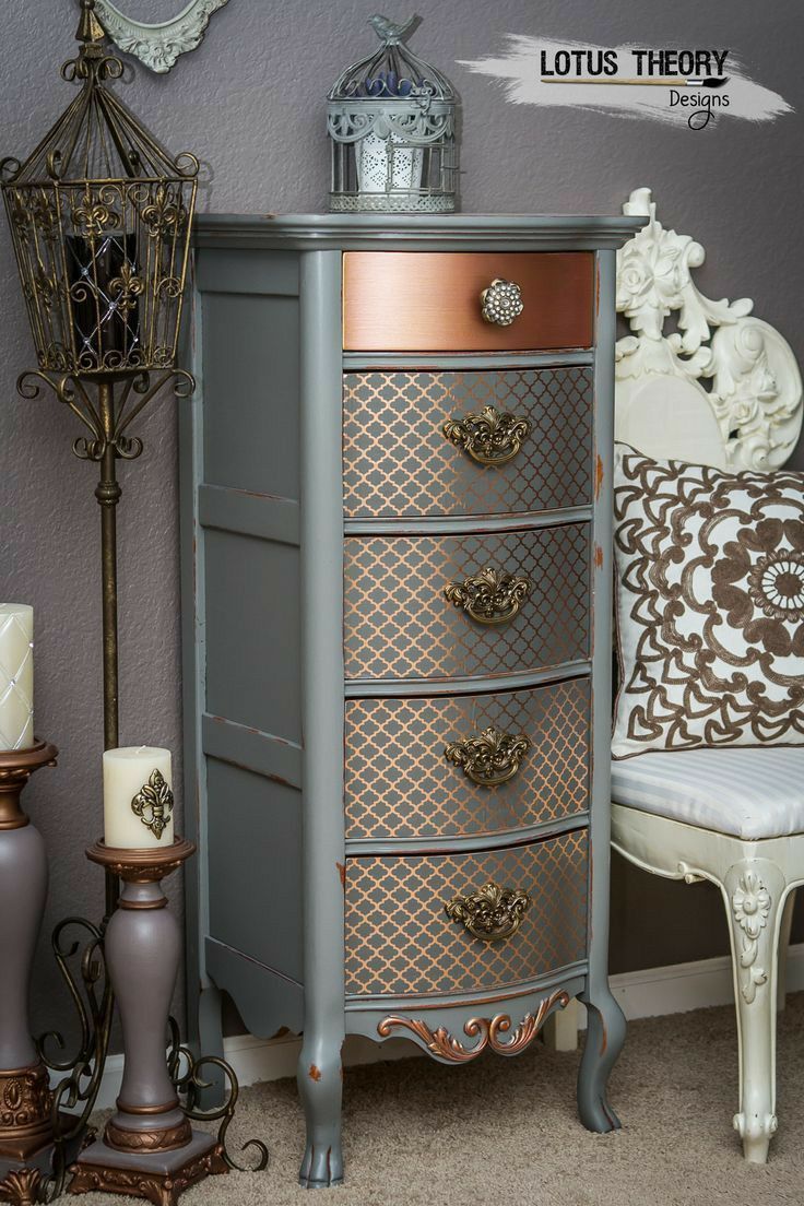 an antique dresser with many drawers and knobs on it's sides, next to a white chair