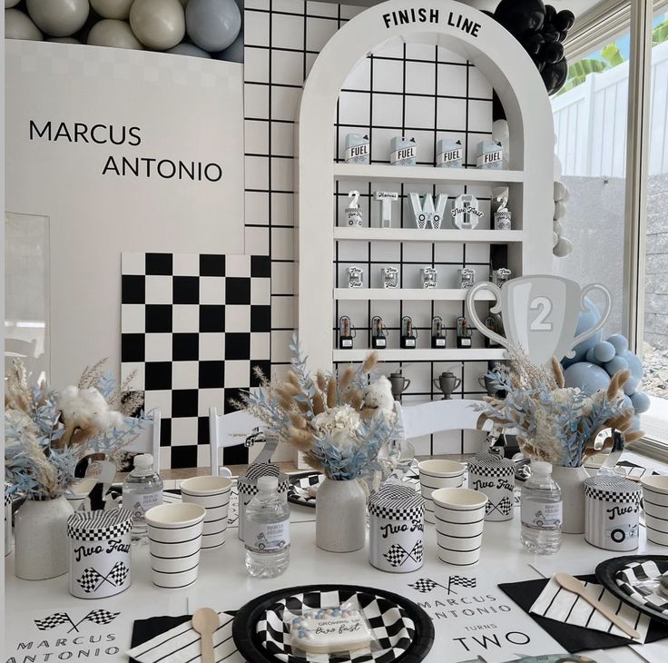 a table topped with lots of plates and cups