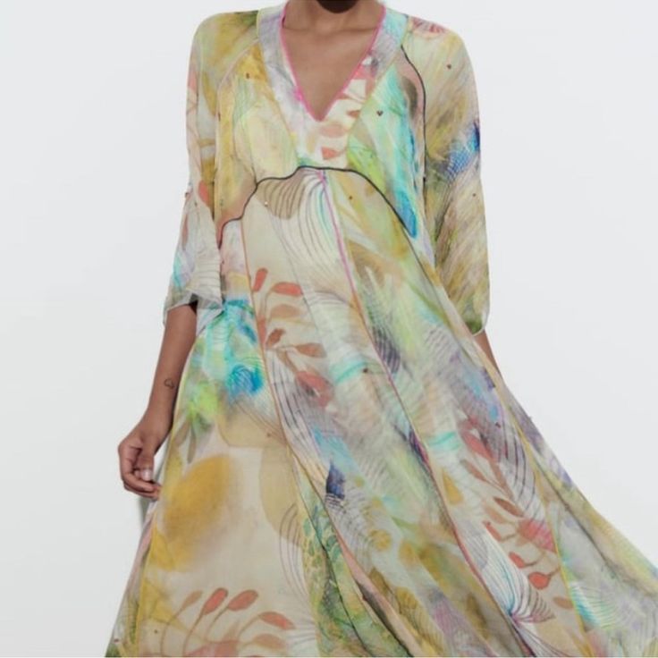 New With Tag Limited Edition Viscose Midi Dress. V-Neckline And Fluid Long Sleeves. Asymmetric Hem. Outer Shell 100% Viscose Lining 100% Polyester Multicolored | 7521/048 680 Multicolor Silk V-neck Midi Dress, Silk V-neck Dress For Vacation, Spring Silk Maxi Asymmetrical Dress, Silk V-neck Summer Dress, Elegant Asymmetrical Multicolor Dress, Elegant Multicolor Asymmetrical Dress, Multicolor V-neck Maxi Dress For Summer, Chic V-neck Silk Dress With Floral Print, Spring Maxi Dress With Notched Neckline