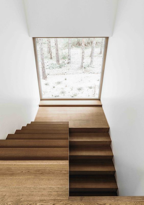 the stairs are made out of wood and have been designed to look like it is going down