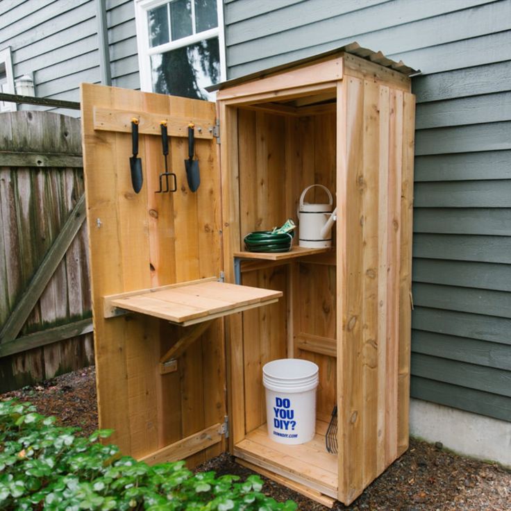 an outdoor storage shed with tools in it