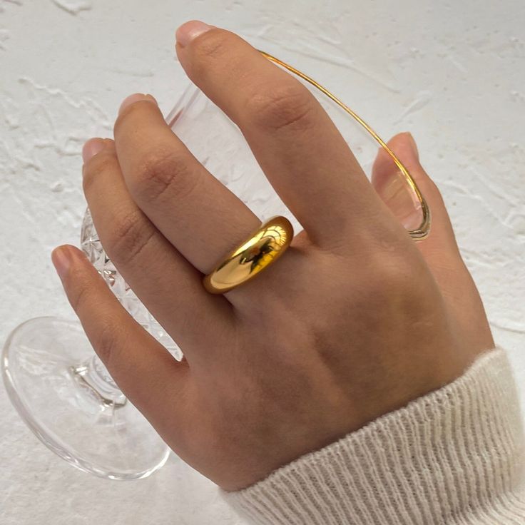 Elevate your style with the Gold Dome Ring, crafted with 18k gold-filled for a luxurious finish. This ring features a sleek, rounded dome, blending timeless elegance with modern sophistication. Gold Dome Ring, Feminine Jewelry, Dome Ring, Chunky Rings, Sleek Style, 18k Gold Jewelry, Domed Ring, Sleek Fashion, Classic Ring