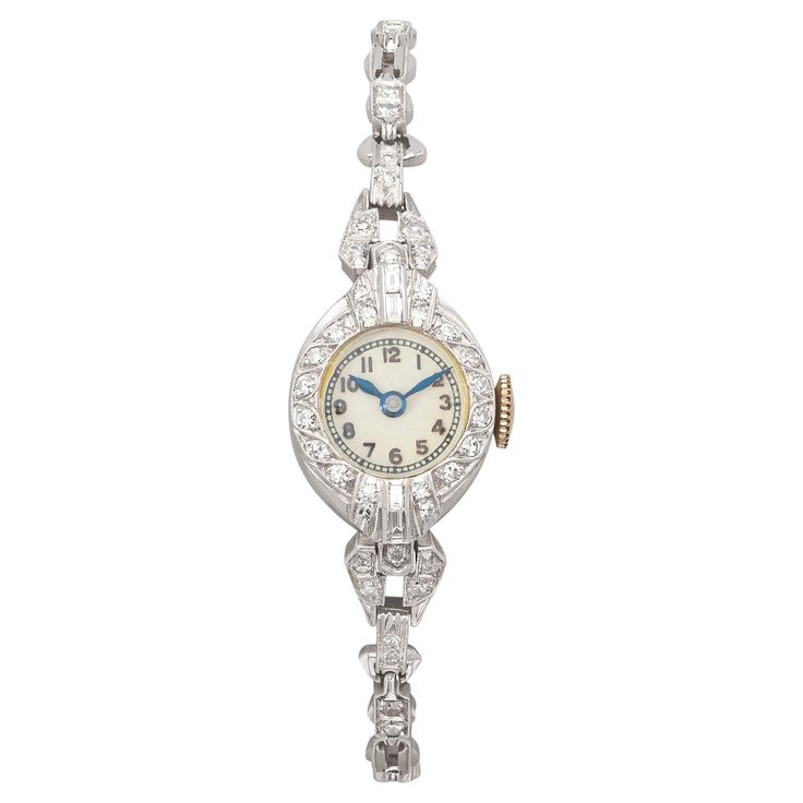 One can almost feel the stories that this watch carries from being passed down through the years. This beautiful antique platinum diamond watch features approximately 52 sparkling diamonds for 0.80 carats. The watch is still in good working order and is engraved with the initials "A*L*A" on the back of the case. This antique diamond watch measures 6 inches in length and weighs 15.9 grams. Step back in time with this elegant vintage watch. Antique Costume Jewelry, Antique Watches, Antique Diamond, Diamond Watch, Sparkle Diamonds, Back In Time, Vintage Watches, The Watch, Costume Jewelry