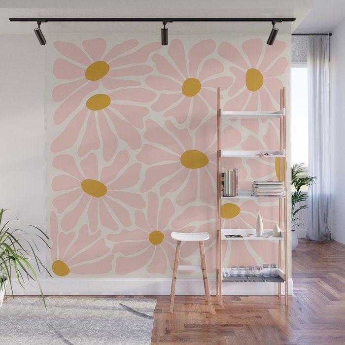 a pink and yellow flower wall mural in a living room