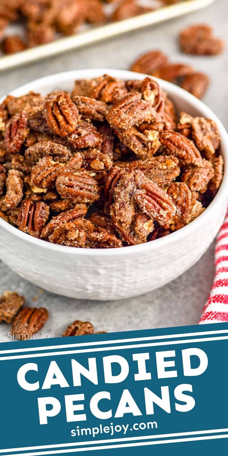 a white bowl filled with pecans on top of a table