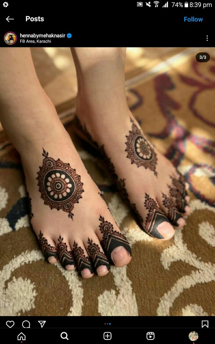 the feet are decorated with henna tattoos