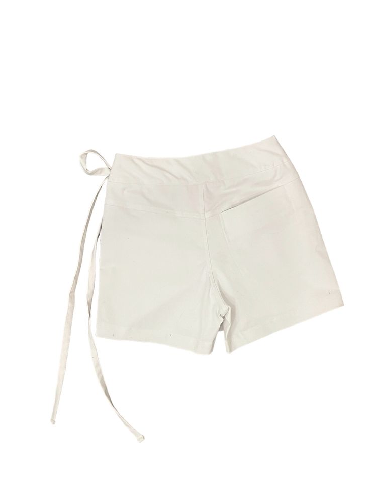 Update your spring wardrobe with the Abbey Skort. Made from a white denim material, this skort features a stylish side tie for added flair. Comfortable, versatile, and perfect for any occasion, the Abbey Skort is a must-have for spring and summer! Stay on-trend and effortlessly chic with this must-have piece. Available in G2 sizing! Chic White Bottoms With Drawstring, Chic White Drawstring Bottoms, White Summer Bottoms With Side Ties, Chic Fitted Shorts With Tie Waist, White Bottoms With Tie Waist And Short Length, White Fitted Drawstring Shorts, Fitted White Shorts With Drawstring, White Tie Waist Shorts, Spring Fitted Shorts With Tie Waist