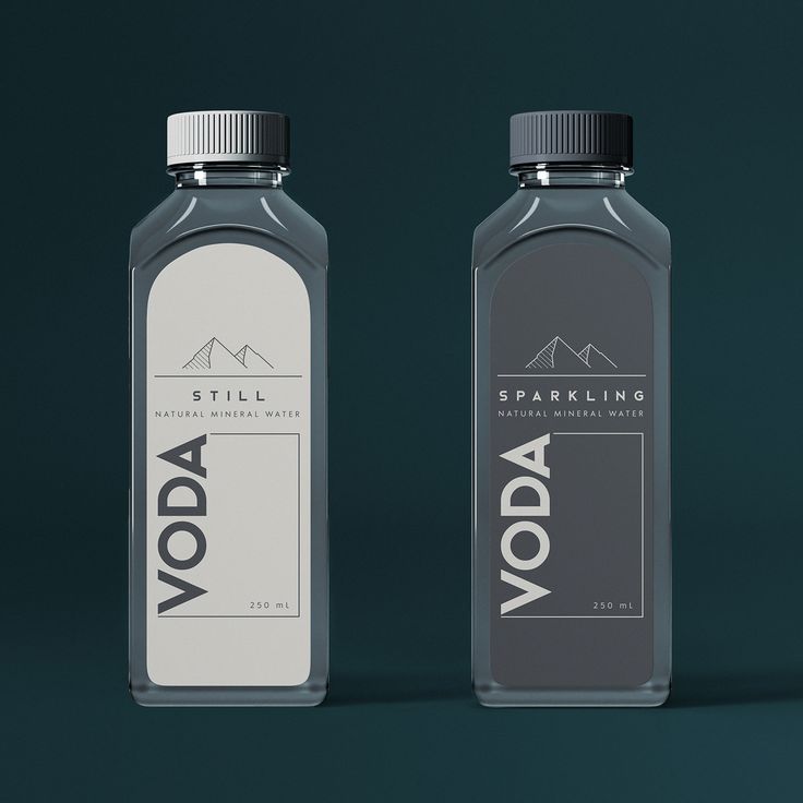 two bottles of vodka sitting next to each other on a green and black background with the word voda written in white