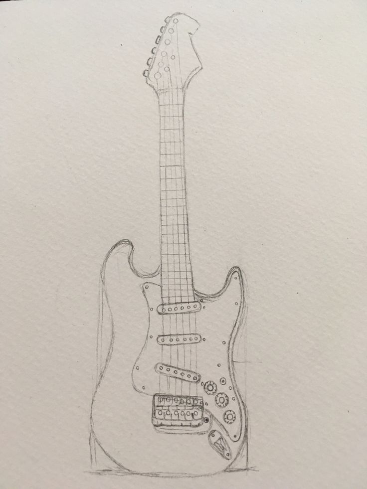 a drawing of an electric guitar on paper with pen and ink in the foreground