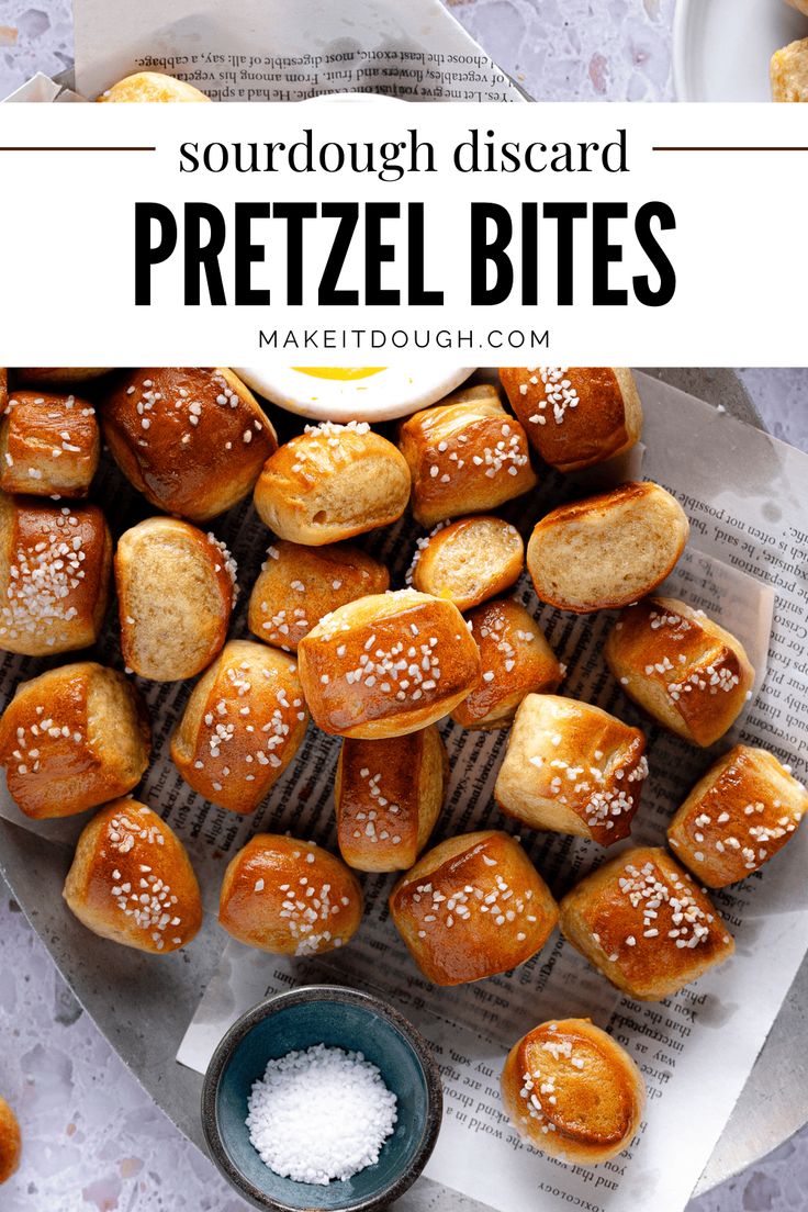 some pretzel bites are sitting on top of a table with salt and sugar