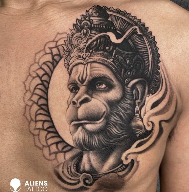 a man with a tattoo on his chest has a monkey wearing a headdress