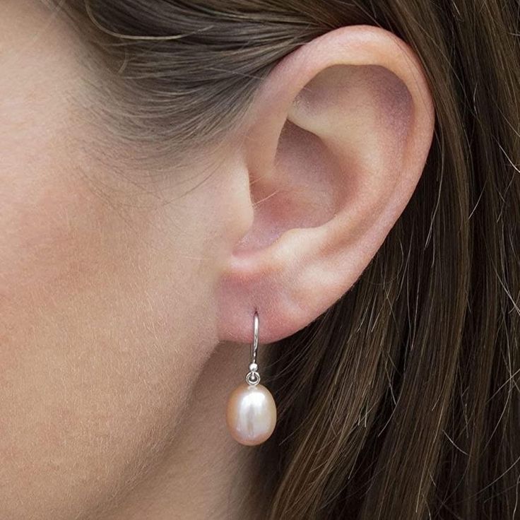 Pearl Teardrop Earrings, Solid 14k White Gold Dangle Earringsm Freshwater Cultured Pearl  9-10mm, Bridal Jewelry for Women  Pearls are a timeless classic, and these understated and lustrous white Tear Drop pearl Earrings are the height of quality. Freshwater cultured pearls offer exceptional luster that is unmistakable, especially when compared side-by-side with man-made shell pearls like Majorica, or other cheaper imitations.  We offer these feminine Hanging Earrings in a comfortable wire hook back for comfortable all-day wear. The 14K White Gold settings feature a single hanging pristine shiny pink pearl. Enjoy wearing these classic dangling earrings as your signature jewelry! They're perfect paired with everything from jeans to sequins, day or night.  ITEM DETAILS ♥ Metal: 14K White Gol Classic Round White Gold Teardrop Earrings, Classic White Gold Teardrop Earrings, Classic Hypoallergenic Dangle Pearl Earrings, Dangle Pearl Earrings With Lever Back, Classic Single Drop Pearl Earring, Fine Jewelry Drop Pearl Earrings, Classic Drop Pearl Earring, Drop Pearl Earrings Fine Jewelry, White Gold Pear-shaped Pearl Earrings