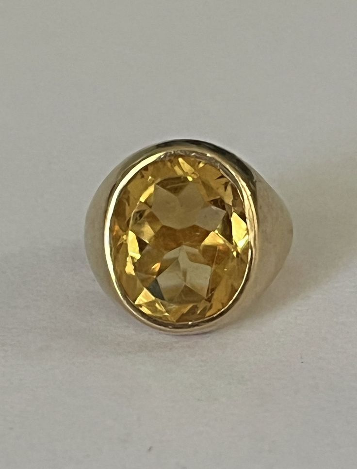 Signet ring in yellow gold (18k) centered with a faceted oval citrine in a closed setting. HB spread wings eagle hallmark and eagle head hallmark. Tray: 17 x 15 mm. Gross Weight: 14.42 g. Size: 48.5 Possibility of sizing, contact us. Further information : We issue an invoice as well as a certificate of authenticity established by our qualified gemologist (LFG Paris). Our photos are not reworked and are taken in a natural light environment. We can send you a short video upon simple request. Each Yellow Oval Topaz Ring In 14k Gold, Classic Hallmarked Citrine Jewelry, Gold Oval Faceted Ring, Elegant Yellow Hallmarked Signet Ring, Oval Gold Faceted Rings, Elegant Yellow Signet Ring For Formal Occasions, Classic Round Gold Gemstones, Gold Oval Topaz Ring Stamped 14k, Classic Citrine Jewelry