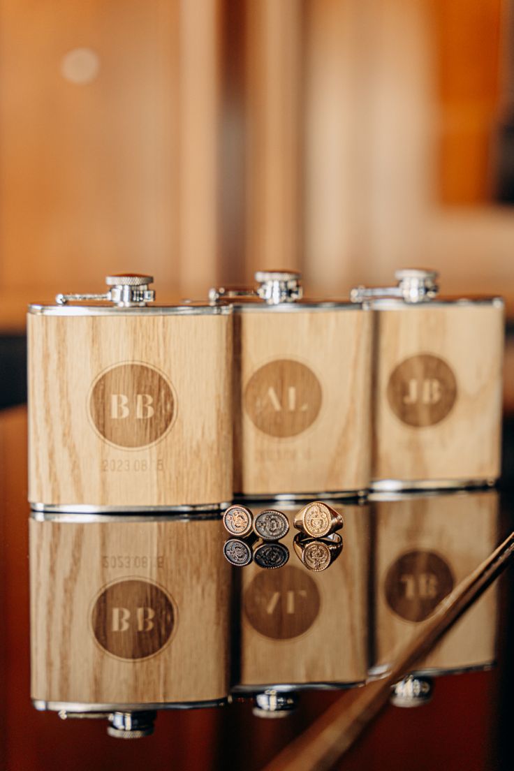 four wooden flasks are stacked on top of each other