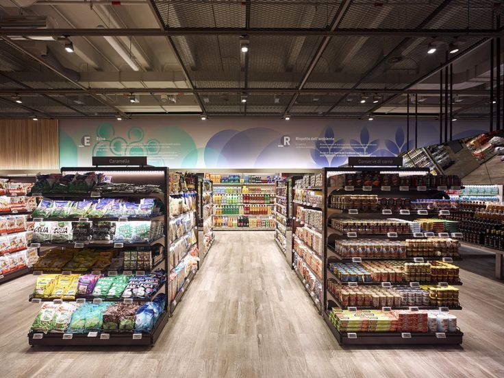 a grocery store filled with lots of food and drink bottles on display next to each other