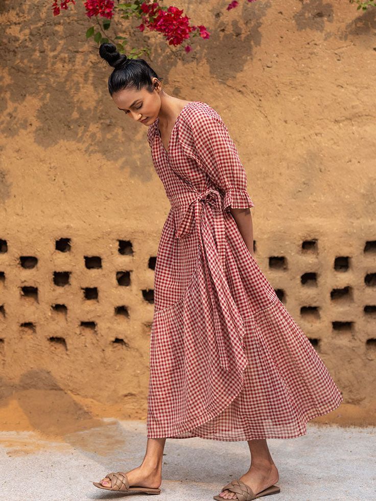 VALUES Handcrafted Organic Fair Minimal Waste CURATOR'S NOTE New possibilities and unknown paths. Explore a new side of yourself in liberating silhouettes that let you be. This fluid checked knot wrap dress comes with side pockets. THE DESIGNER STORY KHARA KAPAS, meaning 'pure cotton' in Hindi, started with the belief that design is a form of expression. True to its name, the brand continuously strives to achieve purity through their fabrics, designs and ethical business practices.With a firm be The Road Not Taken, Sustainable Clothing Brands, Check Dress, Printed Wrap Dresses, Gingham Print, Sustainable Clothing, Online Clothing Stores, Dressed Down, Aza Fashion