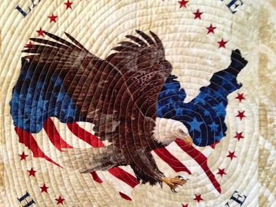 an eagle with the american flag painted on it