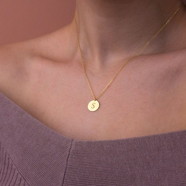 This stylish and minimalist 14K gold initial necklace is a great choice for both casual everyday outfits and for special occasions. Simple yet design of this dainty gold initial necklace allows you to dress up or dress down depending on the situation. Show your love to the special people in your life with this dainty gold initial necklace. It makes a perfect custom birthday gift for mothers, friends, or even yourself. Add the initials of your family members for a personalized gift for mothers an Minimalist Initial Necklace For Mother's Day, Minimalist Yellow Gold Initial Necklace For Personalized Gift, Minimalist Initial Pendant Necklace Gift, Simple Everyday Charm Necklace With Initials, Dainty Gold Initial Necklace For Birthday Gift, Dainty Gold Initial Necklace Birthday Gift, Dainty Gold Initial Necklace For Birthday, Simple Initial Necklace In Yellow Gold, Simple Yellow Gold Initial Necklace As Gift