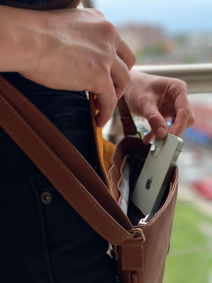 Crafted in small batches by artisans in the highlands of Ecuador, the Leather Envelope Crossbody is produced with high quality materials for everyday use to fit any occasion. Featuring adjustable strap, one external back zippered pocket, one internal zippered pocket, and two internal open pockets to store your cell phone and more. The purse zippers shut and the envelope-shaped flap effortlessly closes magnetically. Measurements: Size 8.5" (21.59 cm) tall x 12" (30.48 cm) wide x 1" (2.54 cm) deep Versatile Shoulder Bag With Hidden Phone Sleeve, Modern Shoulder Bag With Hidden Phone Sleeve For Everyday, Everyday Crossbody Shoulder Bag With Phone Sleeve, Everyday Shoulder Bag With Hidden Phone Sleeve, Versatile Everyday Shoulder Bag With Zipper Pocket, Leather Envelope, Black Crossbody Purse, Ethical Brands, Black Camel