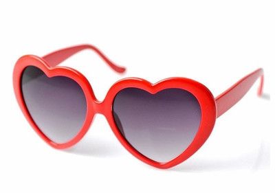 These heart shaped sunglasses are a super cute accessory for any gal! Trendy Heart Print Sunglasses For Valentine's Day, Trendy Valentine's Day Sunglasses With Heart Print, Trendy Heart-shaped Tinted Sunglasses, Trendy Heart Shaped Tinted Sunglasses, Cute Heart Print Sunglasses For Valentine's Day, Fun Heart Print Sunglasses For Valentine's Day, Fun Summer Sunglasses With Heart Print, Fun Heart-shaped Sunglasses With Heart Print, Casual Heart-shaped Sunglasses With Heart Print