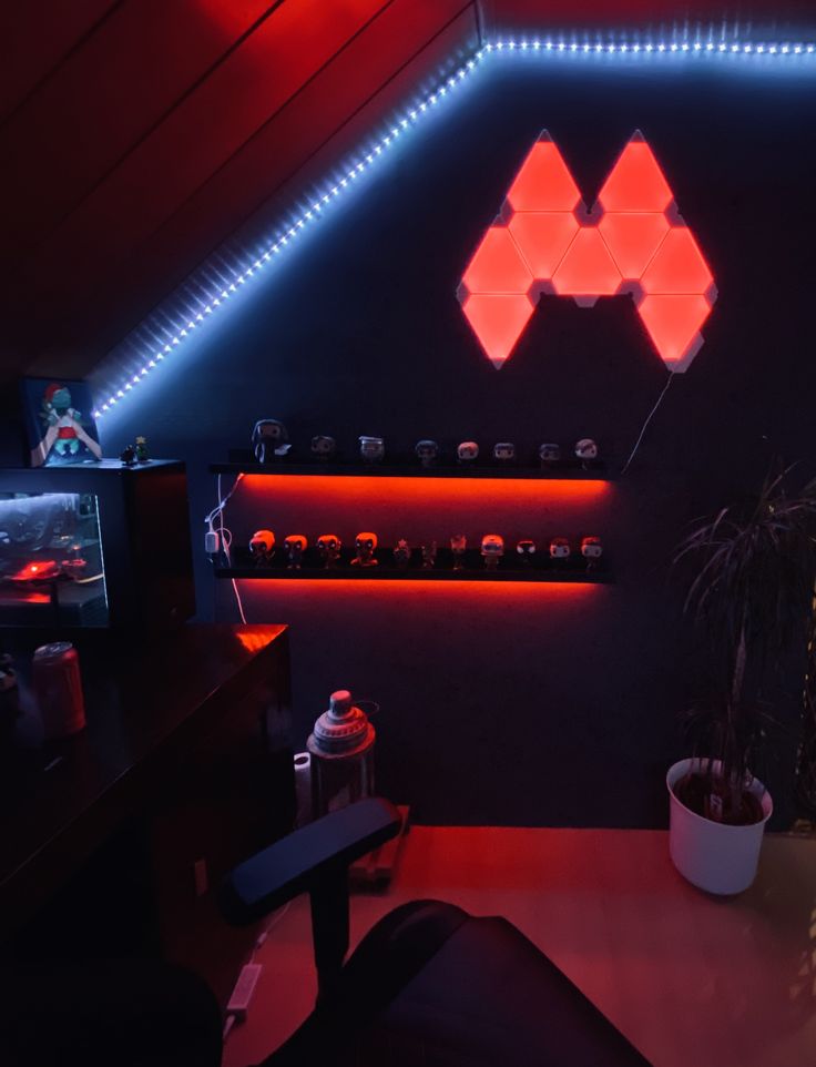 a room with red and blue lights on the walls, some plants in white vases