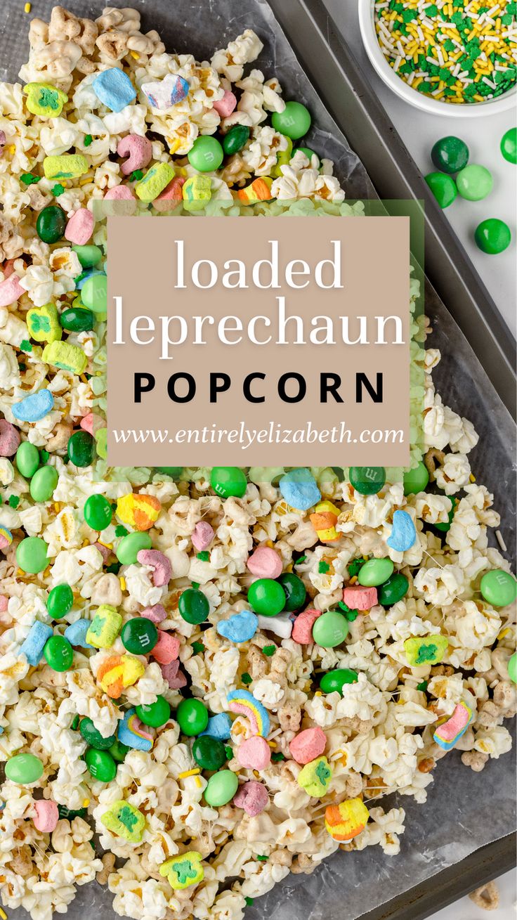 loaded leprechaun popcorn on a baking sheet with sprinkles