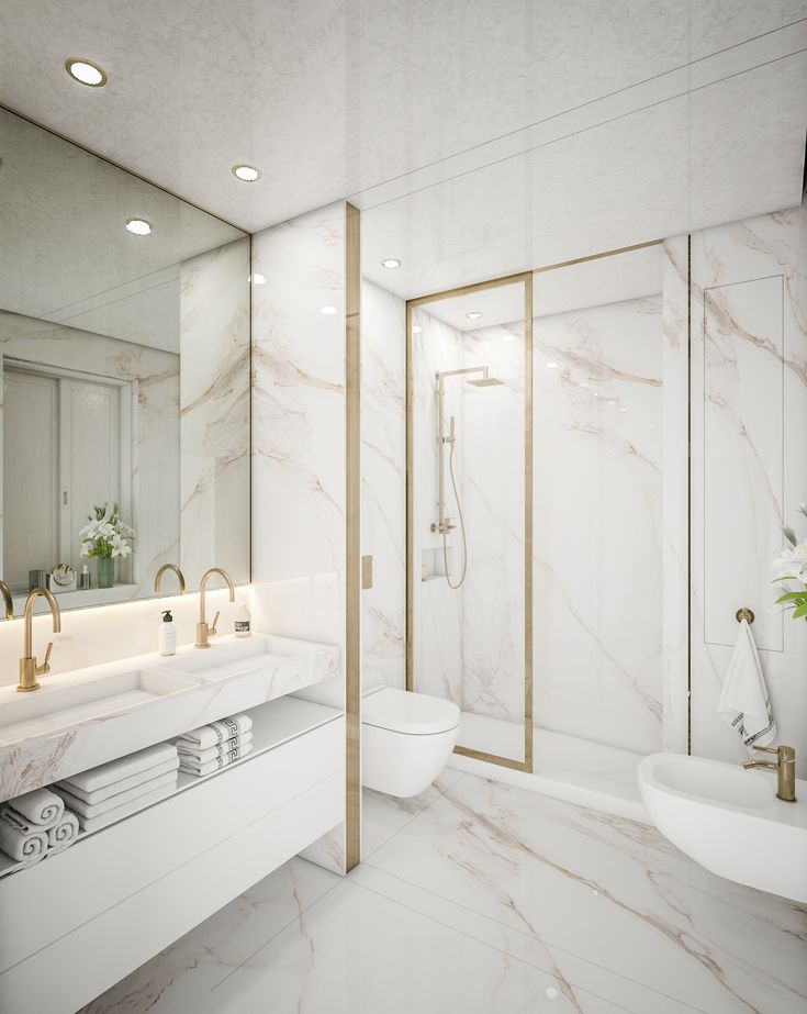 a white bathroom with marble walls and floor