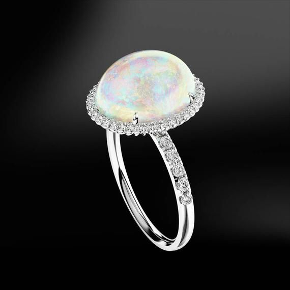 OPAL & DIAMOND Gold RingThis ring is handmade like all our products, with accuracy by our goldsmiths with over 40 years experience. Included in the price is the opportunity to add a personalised touch by engraving your MR jewellery and make it uniquely yours.ITEM INFORMATION-Multicolour OpalWeight: 3.00 caratsShape: Cabochon-DiamondsColour Grade: GClarity: VVSCut Grade: Excellent-Gold 18KAll ring sizes available.MR London are specialists in fine handmade jewellery and gemstones. If you would Luxury Diamond Gemstones With Cabochon Cut, Luxury Diamond Cabochon Gemstones, Luxury Oval Cabochon Diamond Gemstones, Exquisite Platinum Gemstones, Luxury Oval Cabochon Gemstones For Anniversary, Exquisite Round Gemstones With Halo Setting, Fine Jewelry In Platinum With Cabochon, Formal Multi-stone Oval Cabochon Gemstones, Fine Jewelry Platinum Cabochon