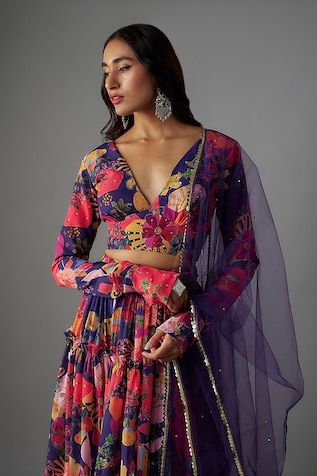 Multi color lehenga with all over bloom carnival print, hand embroidered details and ruffled tiers detailing. Paired with a matching print full sleeves V neck blouse and a sequin lace border embellished dupatta. - Aza Fashions Digital Print Dupatta For Navratri Reception, Digital Print Dupatta For Reception And Navratri, Digital Print Dupatta For Reception At Navratri, Navratri Reception Dupatta With Digital Print, Multicolor Digital Print Lehenga For Reception, Multicolor Party Lehenga With Printed Motifs, Fitted Sharara With Printed Motifs For Reception, Multicolor Floral Print Palazzo Set For Weddings, Digital Print Lehenga For Reception And Navratri