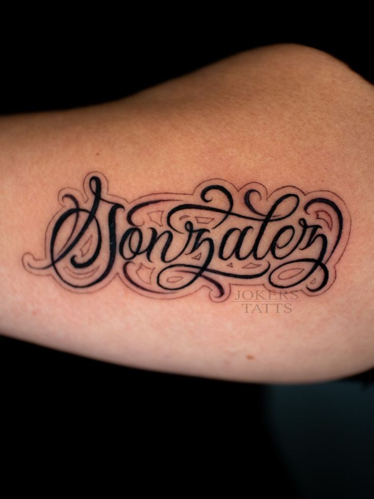 a tattoo with the word sonate written in cursive writing