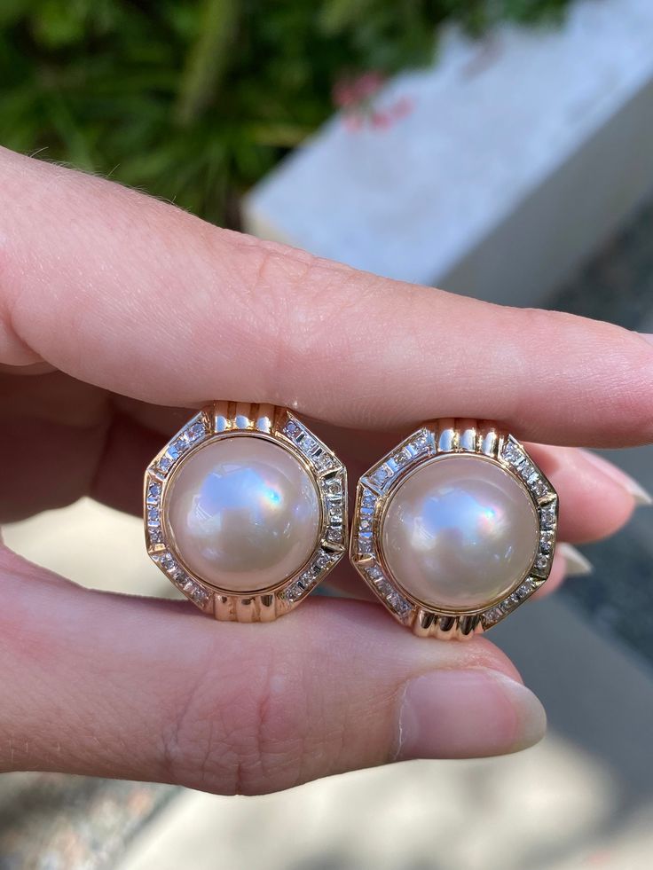 Total Weight: 8.6 grams Length: 21.7mm Width: 19.5mm Pearl: 14.5mm Diamonds: Under 1mm, very small Condition: In great condition showing little wear with no damage. All gold has been thoroughly checked with an Olympus XRF spectrometer. They are guaranteed 14k gold.  All our jewelry is properly washed and disinfected to ensure customers get clean items with every order.  Returns accepted but may be subjected to a restock fee.  Please message with any questions:) Jewelry Real, Diamond Stud Earrings, Pearl Diamond, Diamond Stud, Diamond Earrings Studs, Diamond Studs, Estate Jewelry, Favorite Jewelry, Jewelry Earrings Dangle