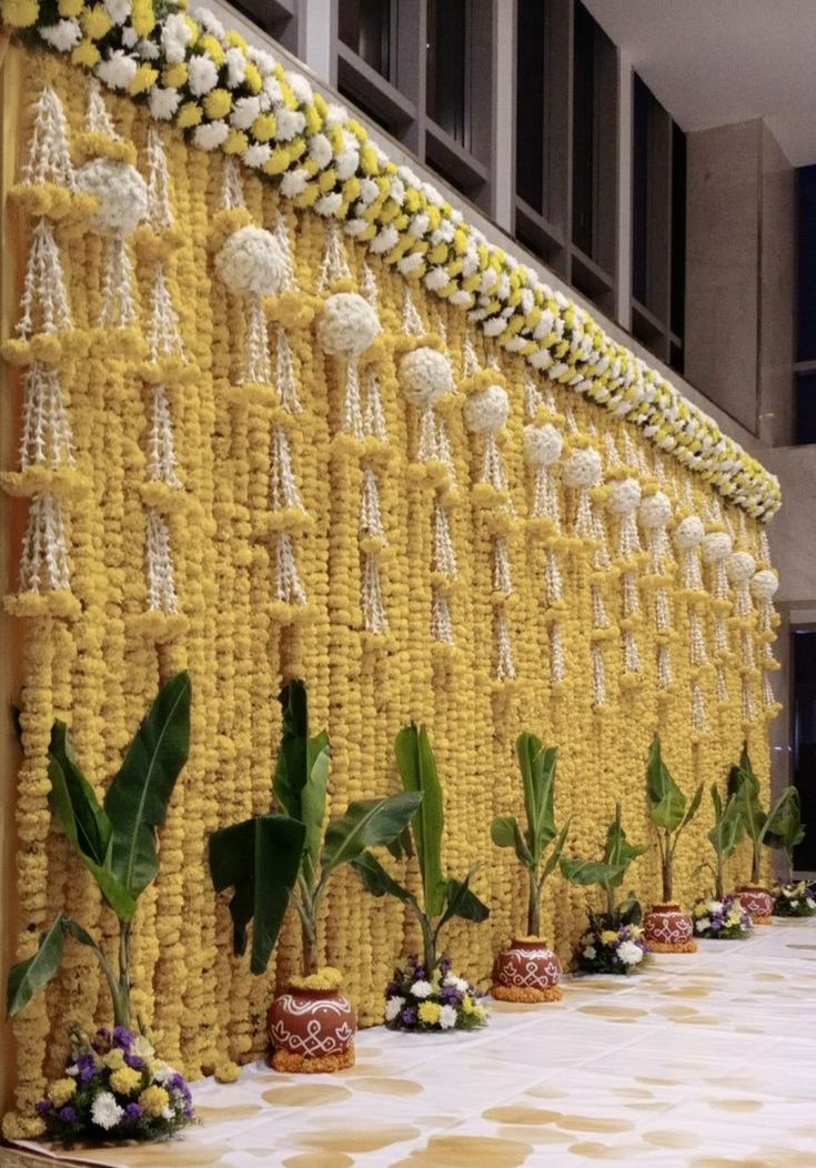 the wall is decorated with yellow and white flowers