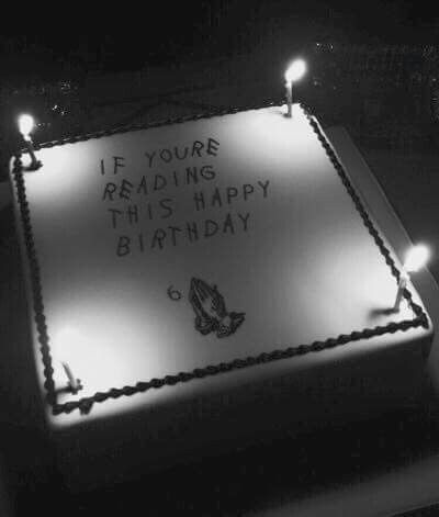 a birthday cake with lit candles in the shape of a square sign that reads, if you're reading this happy birthday