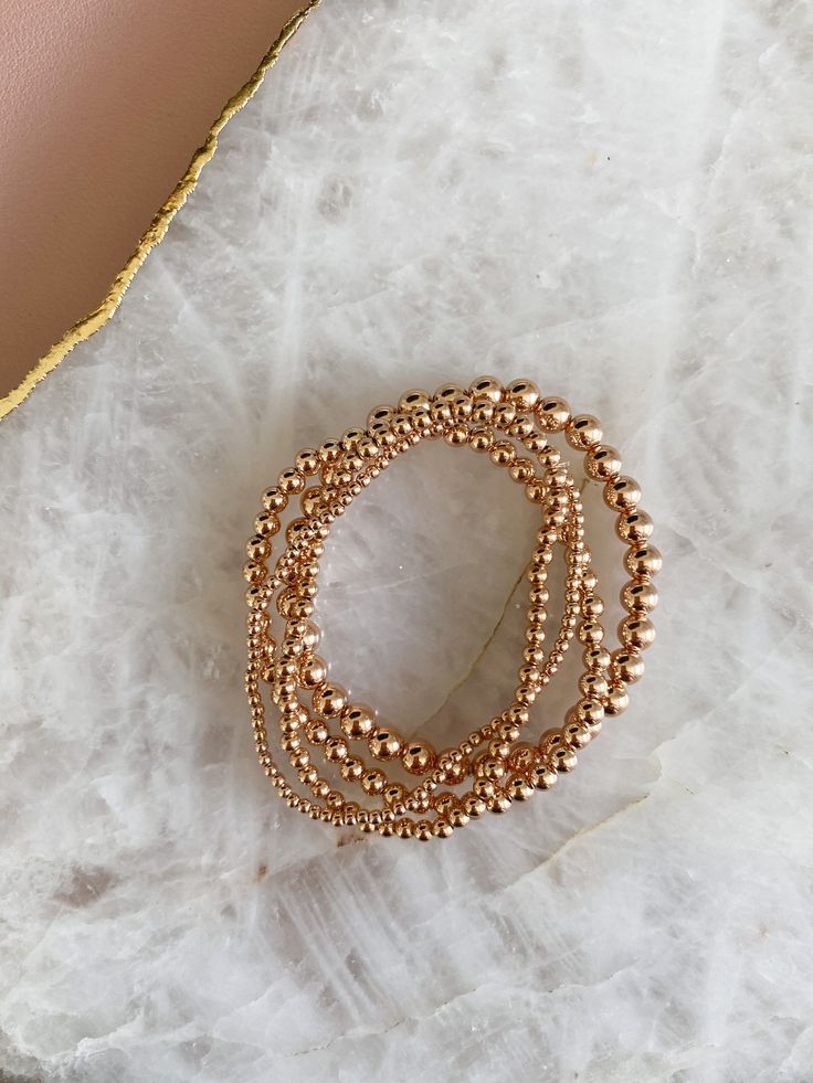 14k rose gold filled beaded stretch bracelet. Please measure your wrist and select your size in the dropdown as this bracelet is not one size fits all. SIZING TIP: To find out your bracelet size, wrap a piece of string around your wrist to measure (place it just above the wrist bone.) Then measure the length of the string. Then I'd recommend adding 0.8 inches (2cm) to that measurement to get your correct bracelet size. Elegant Rose Gold Beaded Stretch Bracelet, Adjustable Rose Gold Beaded Bracelets With 8mm Beads, Rose Gold Beaded Bracelets As Gift, Elegant Rose Gold Beaded Bracelets With 8mm Beads, Dainty Rose Gold Jewelry With Spacer Beads, Elegant Rose Gold Beaded Bracelets With Tiny Beads, Elegant Rose Gold Stackable Stretch Bracelet, Stackable Rose Gold Bracelets In 14k Gold Filled, Rose Gold Beaded Bracelets With 8mm Beads