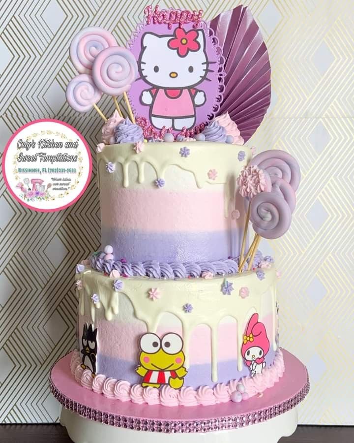 a hello kitty birthday cake with pink, purple and white frosting on it's tiers