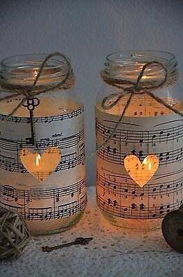 two mason jars with musical notes on them