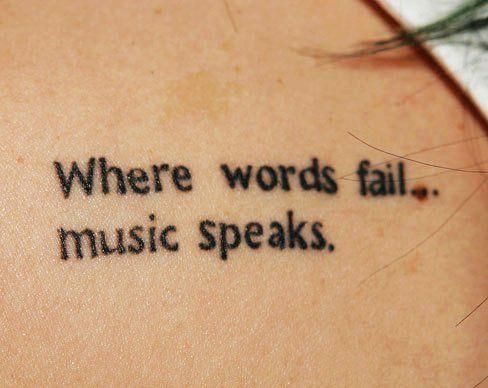 a close up of a person's back with the words where words fail music speaks