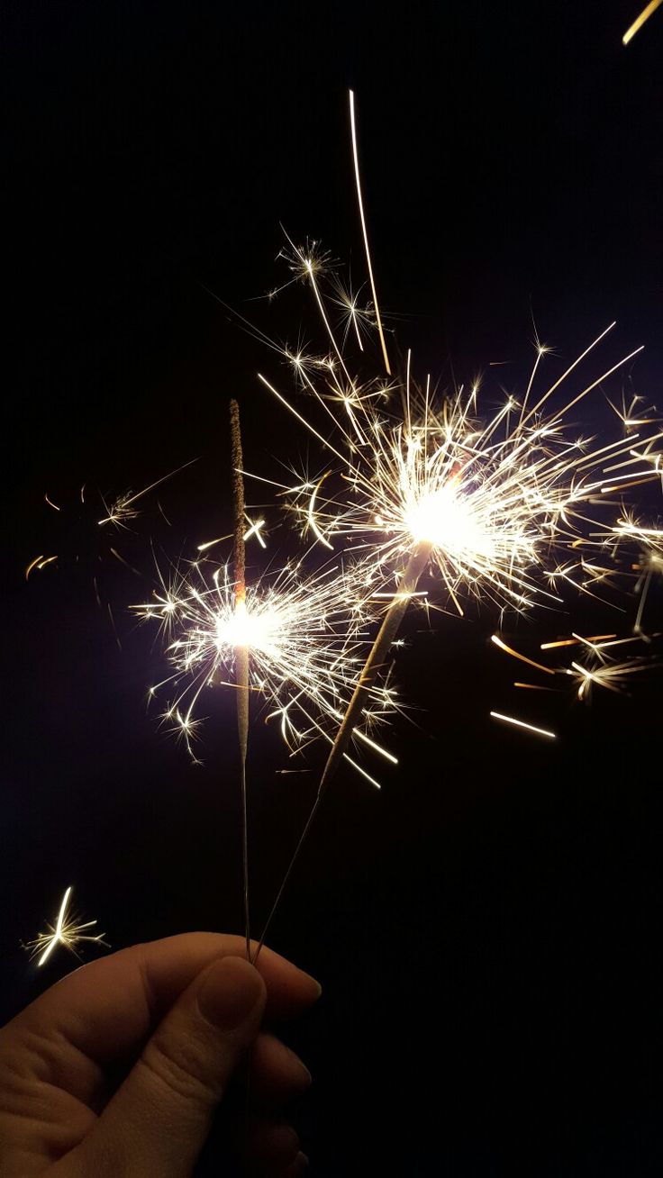 someone is holding a sparkler in their hand