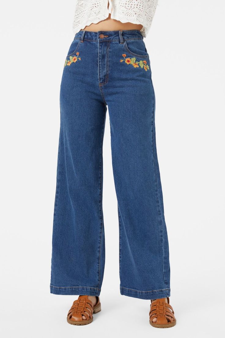 Floral embroidered straight leg jean, featuring gorgeous hand painted nasturtium flowers - Nasturtim mbroidery along front pockets and back yoke- high waisted style- relaxed fit through the leg- front fly with button closure- curved front pockets- patch pockets on back - comfortable cotton elastane denim- available in mid denim Product Code: PGFY272 Embroidered Wide Leg Denim Blue Jeans, High Rise Floral Embroidered Jeans, Embroidered Dark Wash Jeans For Fall, Embroidered Mid-rise Flare Jeans For Fall, Embroidered Denim Wide-leg Bottoms, High Rise Jeans With Floral Embroidery, Embroidered Wide Leg Denim Bottoms, Embroidered Wide-leg Denim Bottoms, Mid-rise Embroidered Flare Jeans For Fall