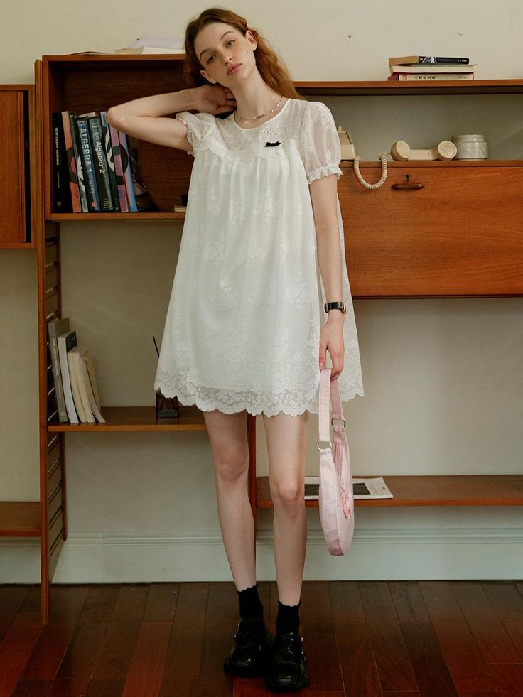 This product, the Cest Baby Doll Lace Dress, embodies a sweet and youthful charm with its delicate lace detailing. The flowy and loose fit provides both comfort and a whimsical aesthetic, perfect for a casual day out or a special occasion. The intricate lace design adds an element of sophistication to this playful dress. - This dress features a baby doll silhouette, offering a relaxed and airy fit.- The lace detailing throughout the dress enhances its delicate and feminine appeal.- Puff sleeves add a touch of vintage charm, complementing the overall design.- The scalloped lace hemline adds a refined finishing touch.- Made from soft, breathable fabric, it ensures comfort while maintaining style. Cute Lace Mini Dress For Brunch, Cute Lace Dress For Brunch, Casual Lace Dress For Day Out, Cute Lace Mini Dress For Spring, Cute Spring Lace Mini Dress, Summer Lace Mini Dress With Lace Collar, Feminine Lace Dress With Lace Collar, Spring Mini Dress With Lace Collar For Daywear, Feminine Lace Patchwork Mini Dress With Short Sleeves