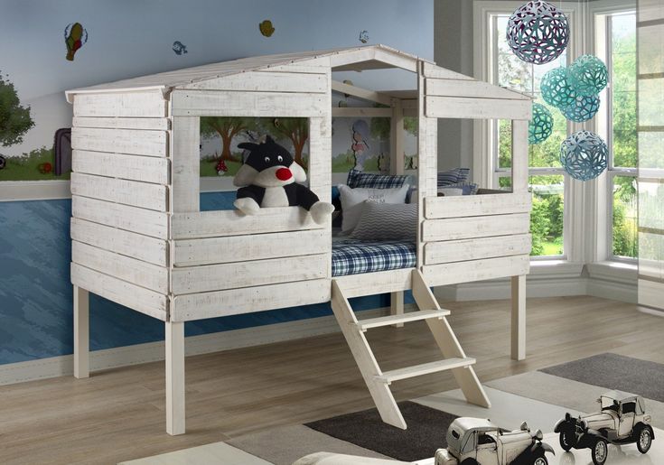 a child's bedroom with a wooden bunk bed and toy cars on the floor