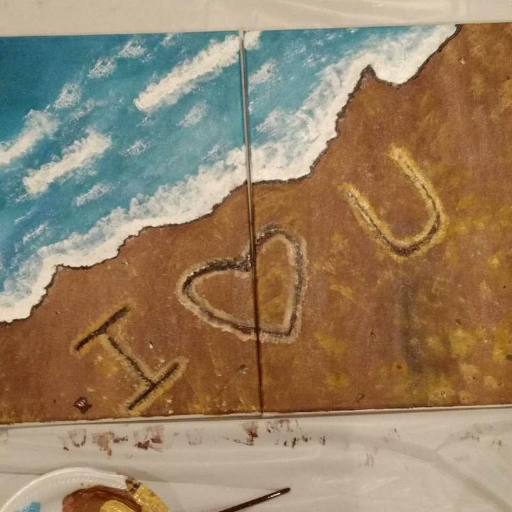 This is a split canvas painting. The whole painting is turquoise blue waves crashing into a sandy beige shore. A message is written in the sand with light tan. The message spells out I - heart in the middle and the letter U. Painting For Two People, Painting With A Twist Ideas For Couples, Writing In The Sand Painting, Matching Couple Painting Ideas, Couples Easy Painting Ideas On Canvas, Connecting Canvas Painting Ideas, Couple Painting Ideas To Do Together, Painting Ideas On Canvas Couples Love, His And Her Painting Ideas