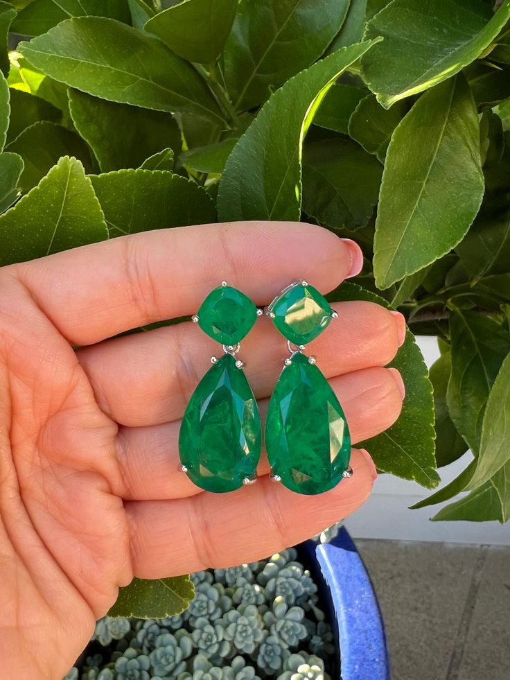 One of a kind statement earrings inspired by Angelina Jolie's famous emerald earrings Hand crafted from sterling silver and simulated emerald green stones, with push back backings Earrings measure 1.5 inches in total length Sku GAE0138 Luxury Emerald Teardrop Earrings, Classic Pear-shaped Emerald Earrings, Exquisite Pear-shaped Emerald Jewelry, Pear Shape Earrings, Pear-shaped Emerald Green Earrings, Luxury Pear-shaped Emerald Earrings, Emerald Green Stone, Pear Earrings, Earrings Emerald