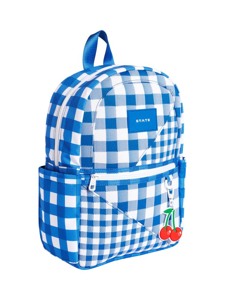 More gingham, please. Perfect for weekend trips and school days, the Kane Kids Mini Travel Backpack - Gingham has all the functionality in the world (pockets, zippers, water bottle holders, padded straps!) with a super fun multi-gingham print and cherry zipper pull. 14" H x 9.5" W x 4" D. Recommended for ages 2-4. Casual Gingham Bags For School, Gingham Backpack For Travel And School, Back To School Gingham Travel Backpack, Gingham Travel Backpack, Travel Backpack In Gingham, Gingham Bags For Travel And Back To School, Back To School Travel Bags In Gingham, Back To School Gingham Travel Bags, Preppy Gingham Backpack